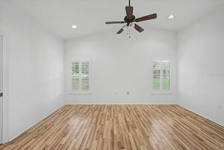 Primary Bedroom with Vaulted Ceilings and Plantation Shutters