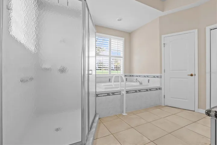 Primary Bathroom with Tub and Walk In Shower
