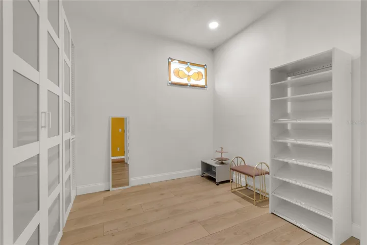 Primary Closet. A most see closet designed that keeps organization and comfort in mind.