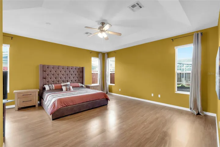 Primary Bedroom. Note the recessed ceiling that add style and elegance to this room.