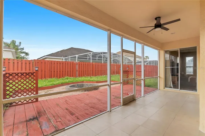 The screened in porch opens to the wood and paver deck. Enjoy Florida at its best!