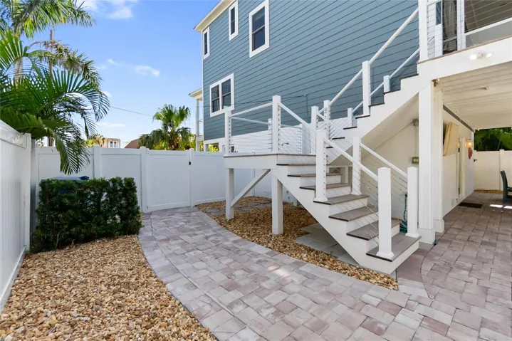 Right side of home, with gate that leads to the front of home