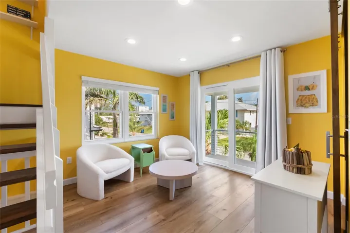 Sitting Area and Hurricane Impact Sliding Glass Doors leading out to Front Deck