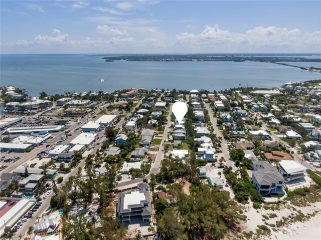 View of the Intracoastal (background) and amazing shopping and dining that Holmes Beach has to offer (left side of the photo)