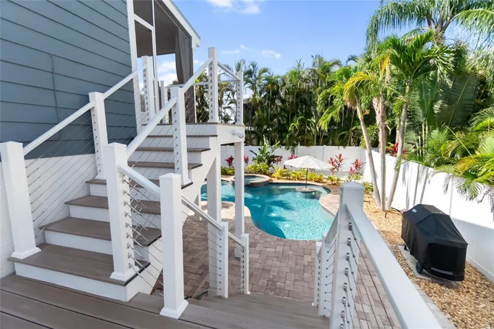 Staircase was recently rebuilt with Trex Decking, leading down to your backyard oasis complete with grill