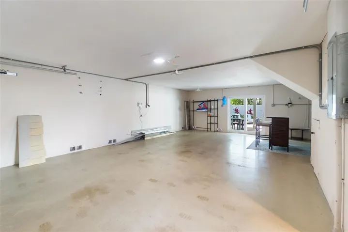 Garage runs the entirety, front to back of the home