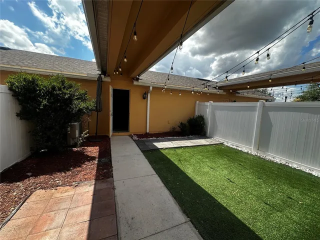 Private fenced patio (towards the garage).
