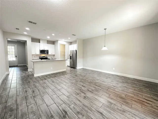 Modern open concept-high ceiling, kitchen, living and dinning area