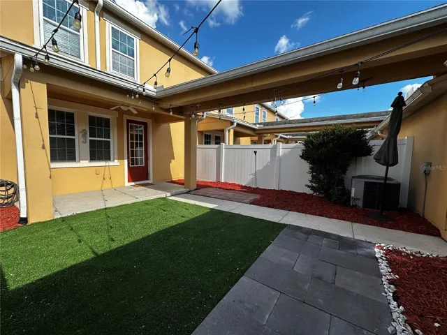 Covered lanai and private fenced patio