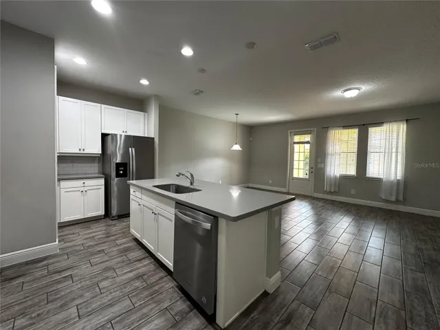 Open concept-high ceiling living room, dinning room and kitchen at first floor.