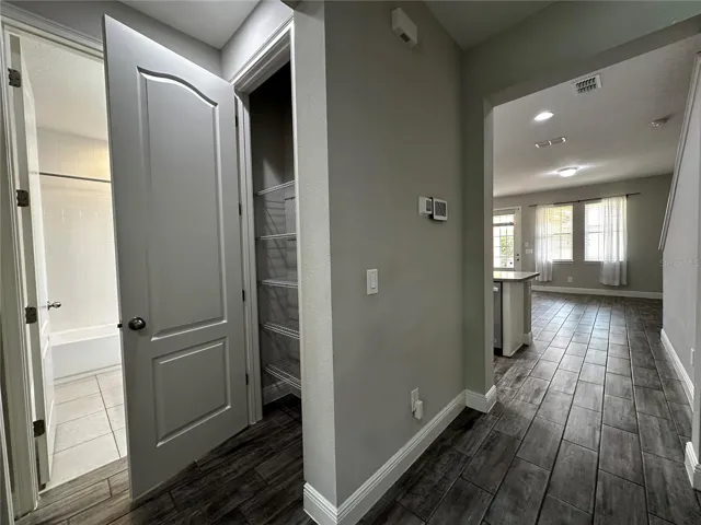 In-law suite linen closet at first floor.