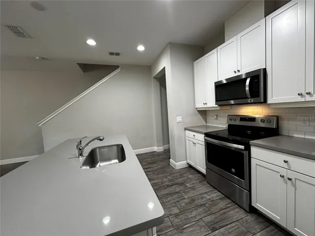 Kitchen at first floor, stainless steel appliances.