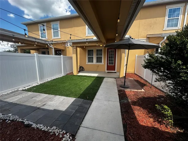 Covered lanai and private fenced patio