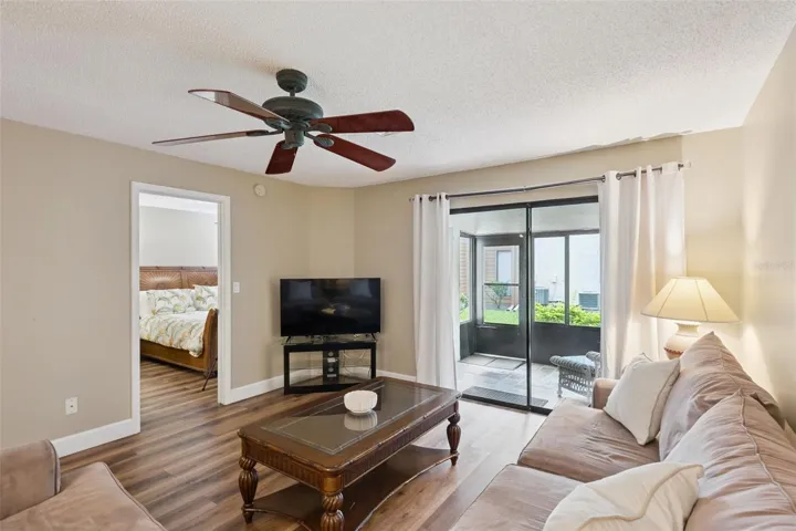 Living room with Sliders to Sunroom