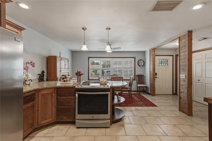 Another view of both kitchen/dining rooms.