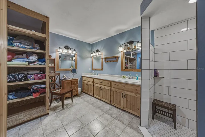 Large dressing area in primary bath.  Walk-in shower is to the right of the picture.