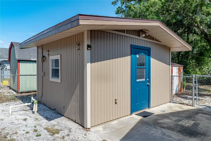 Air-conditioned shed provides a place for watching football games, an office, workshop or she shed or whatever you want.