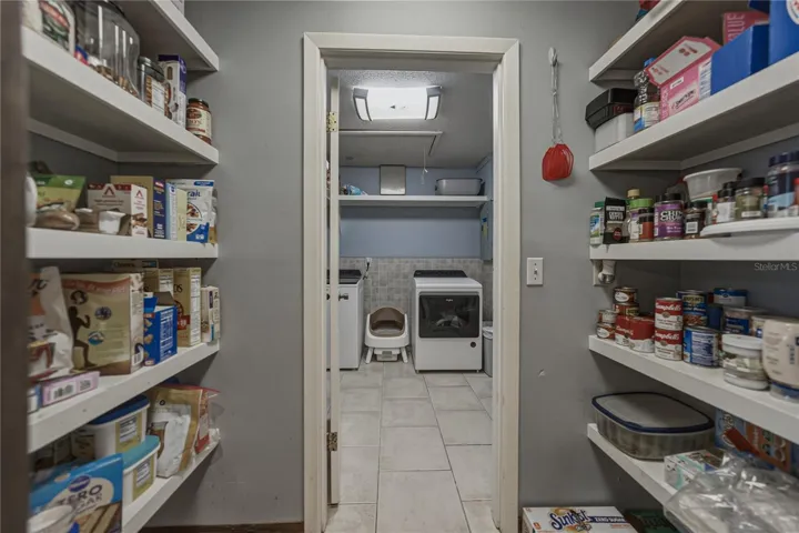 Pantry located right off the kitchen.  Doorway leads into the inside utility room.