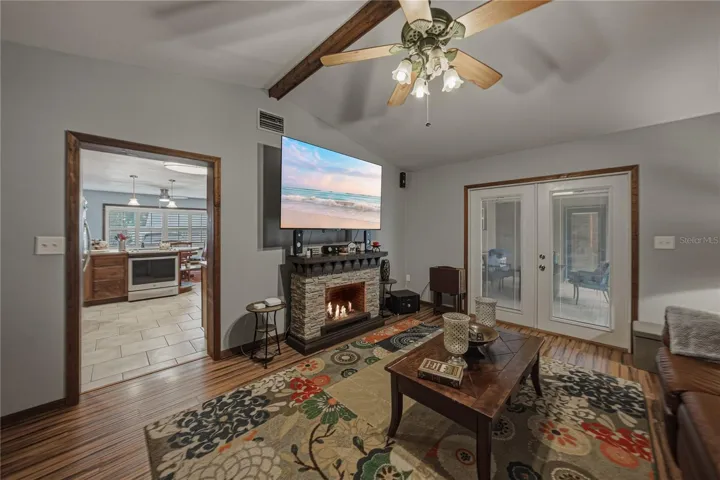 French doors in the great room lead to the screened porch.