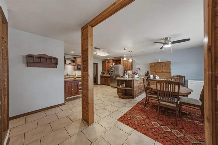 View of dining area/kitchen as you enter the home.