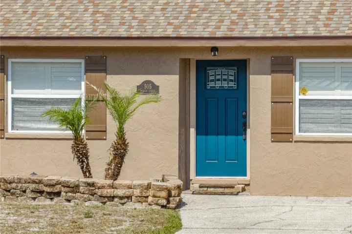 Beautiful front door with glass insert.