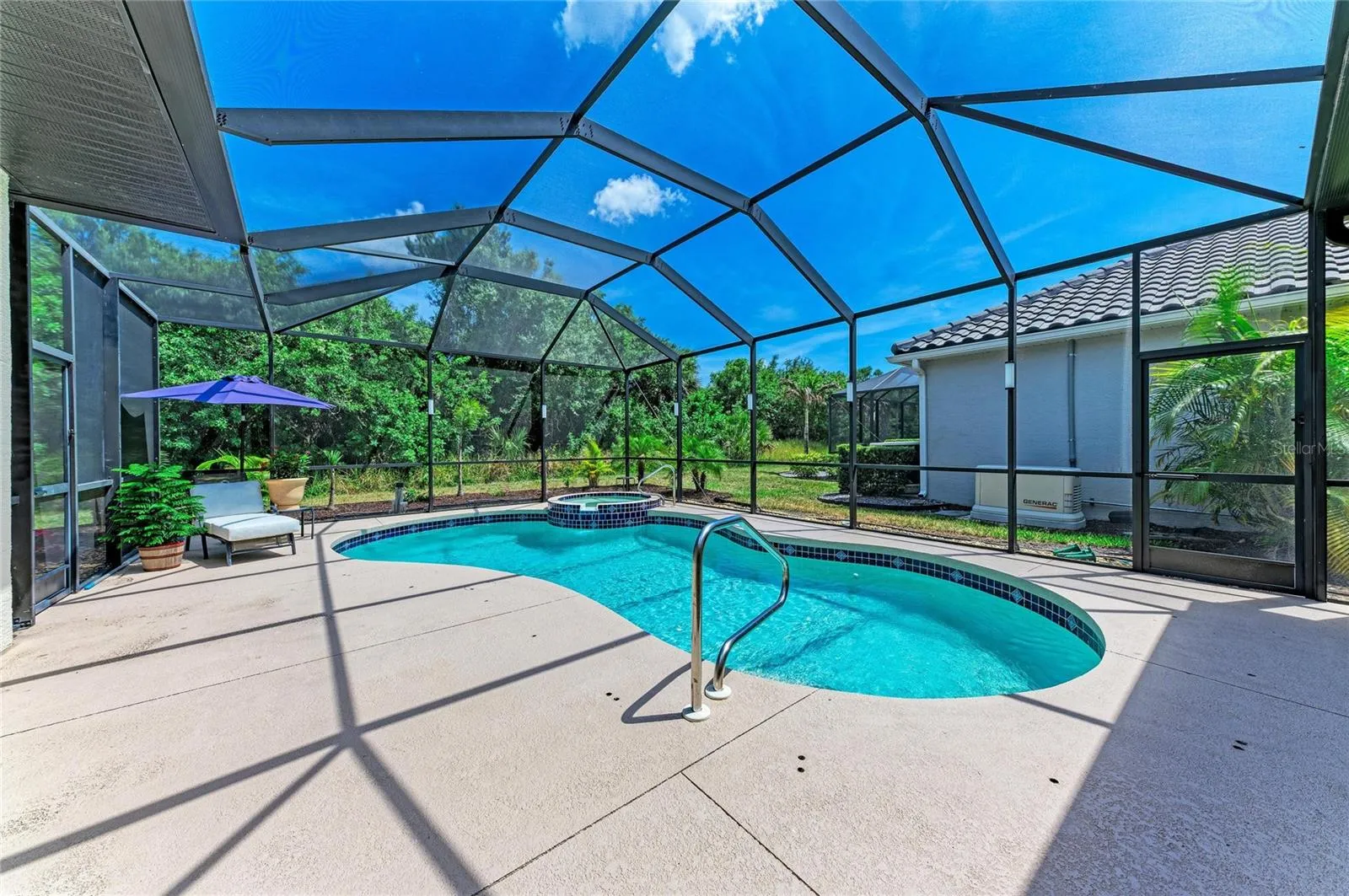 Screened pool, spa, patio area facing Greenbelt