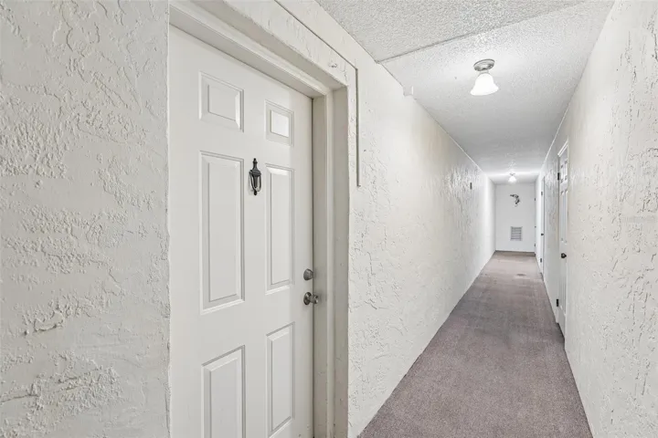 Condo door immediately on left. Garage is last door on the right