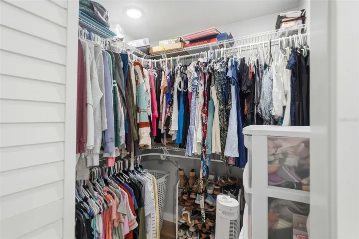 Primary bedroom walk-in closet 1
