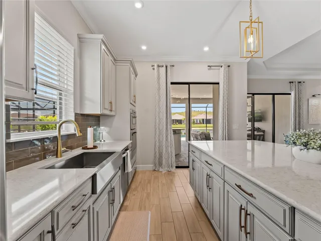 Sliding glass doors leading directly to the pool area for seamless indoor-outdoor entertaining.