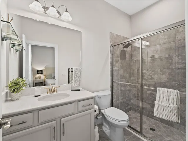 Bedroom three private ensuite bathroom with beautifully appointed glass-enclosed shower.