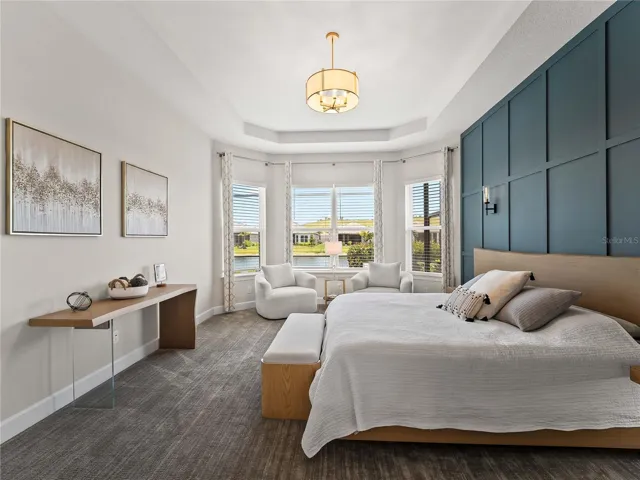 Enjoy the beautiful lake view and soaring windows that fill the home natural light.