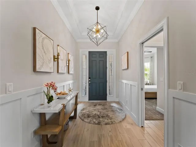 An inviting entryway welcomes you and flows naturally toward one of the two guest bedrooms.