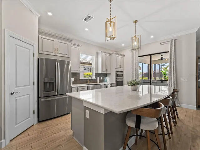 A convenient corner pantry and counter-height seating, offering both smart storage and a comfortable space for casual dining.