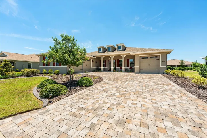Beautiful 2021 Aberdeen Model in West Kestrel of Candler Hills with exceptional curb appeal, professional landscaping, paver driveway, welcoming front porch, Zoysia grass, full-yard irrigation, concrete curbing, gutters, and leaders. This desirable floor plan offers two primary suite options, plus Hunter Hydrawise irrigation for added convenience.