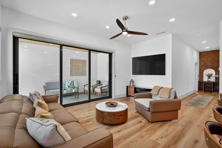 Living room opens to Covered Balcony