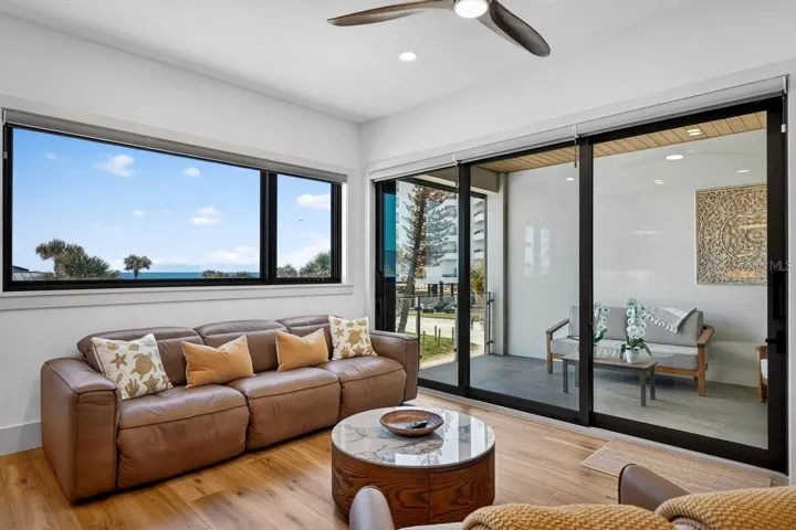 Living room opens to Covered Balcony