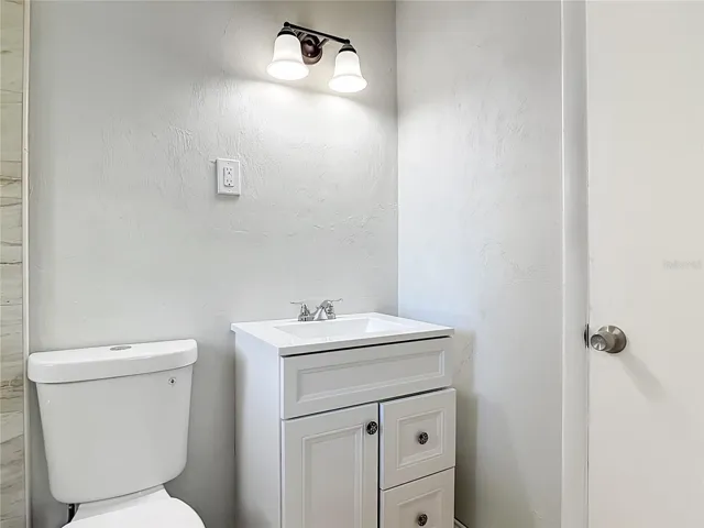 the new vanity and toilet in the main bedroom bathroom