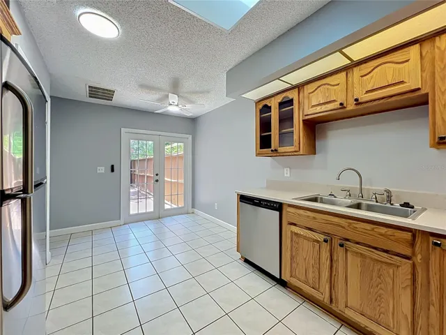 Kitchen view with walkway to the backyard.