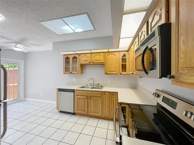 Kitchen with wood cabinets and Stainless