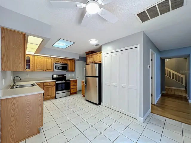 Kitchen with wood cabinets and Stainless