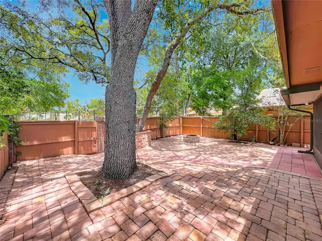 Outdoor paved backyard perfect for entertaining