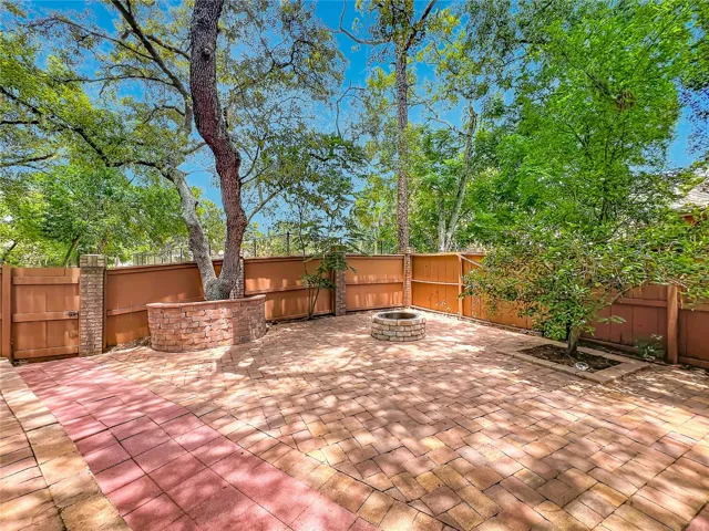 Outdoor paved backyard perfect for entertaining