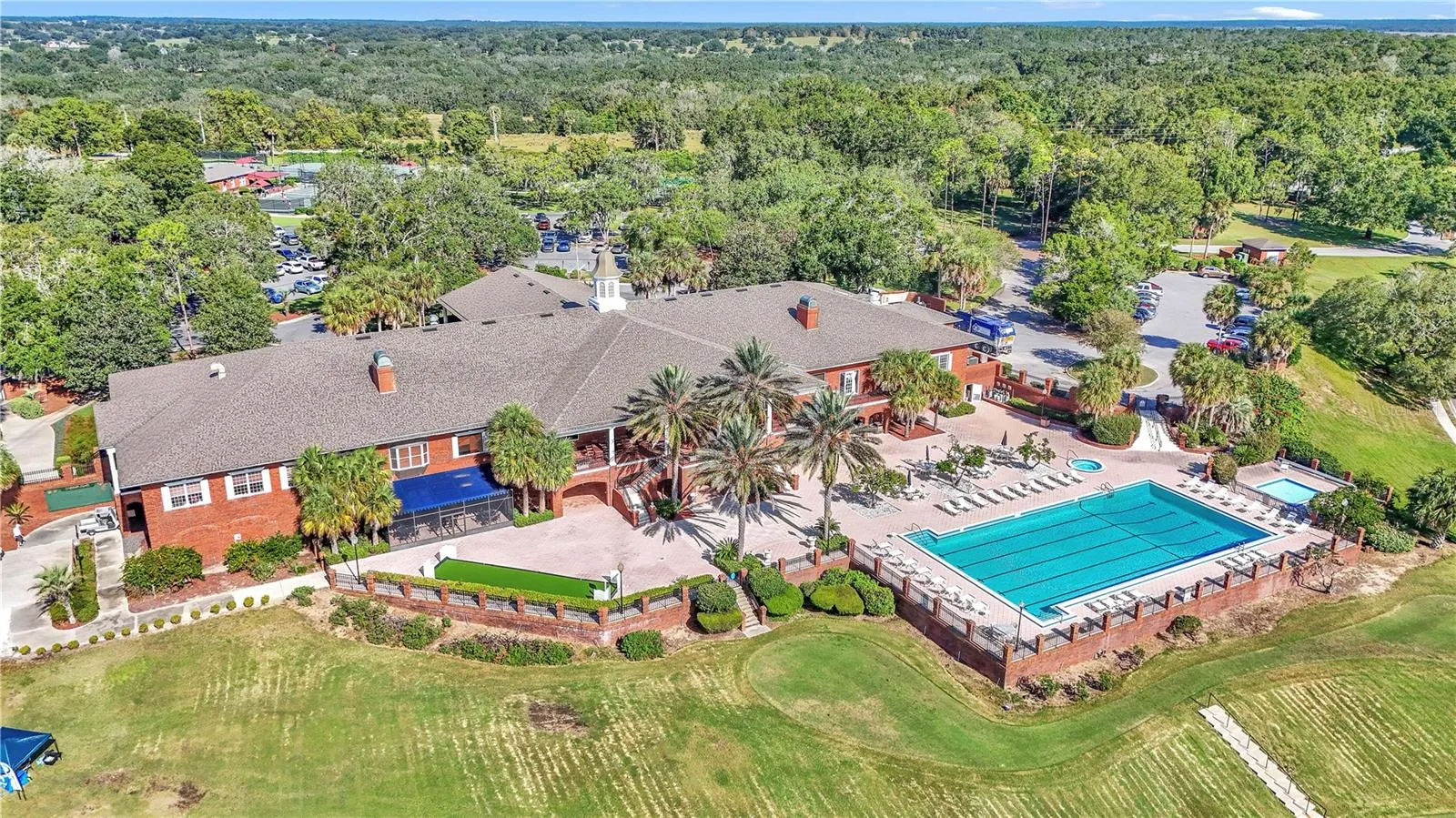 Jr Olympic size pool overlooking golf course and view of Lake Griffin