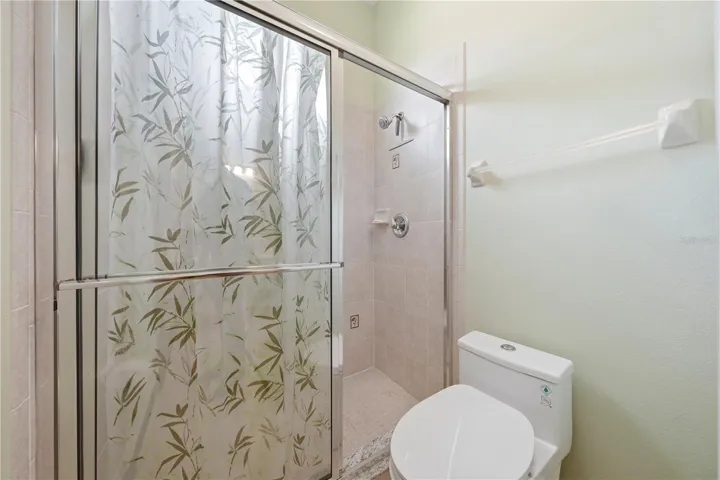 Guest tile shower with window for natural light