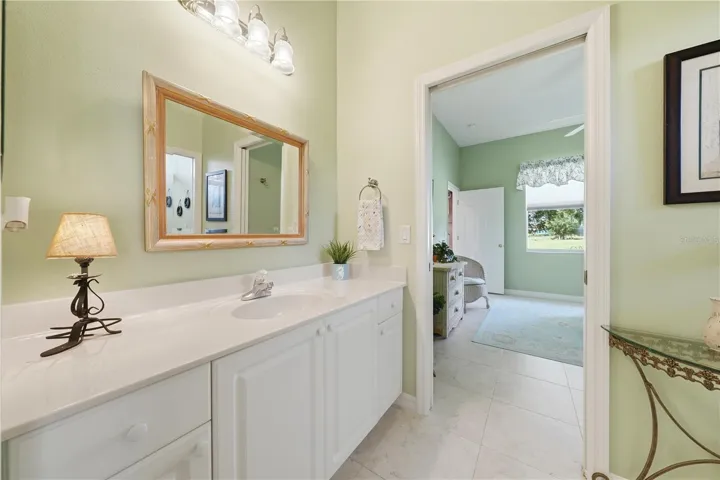 Pocket doors makes this Jack and Jill bath a breeze for guests to enjoy.  Large vanity