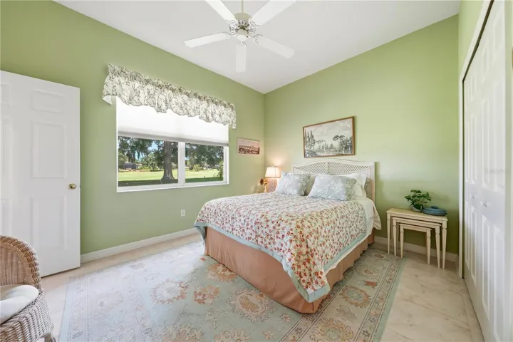 Queen size guest bedroom - view of golf course - large built in closet