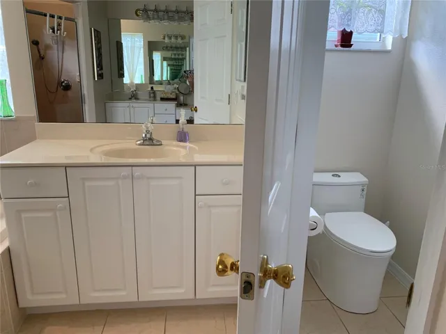 His side of master bathroom - water closet