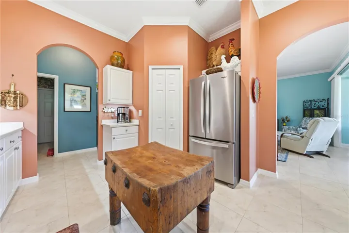 Kitchen corner walk in pantry - stainless applicaces