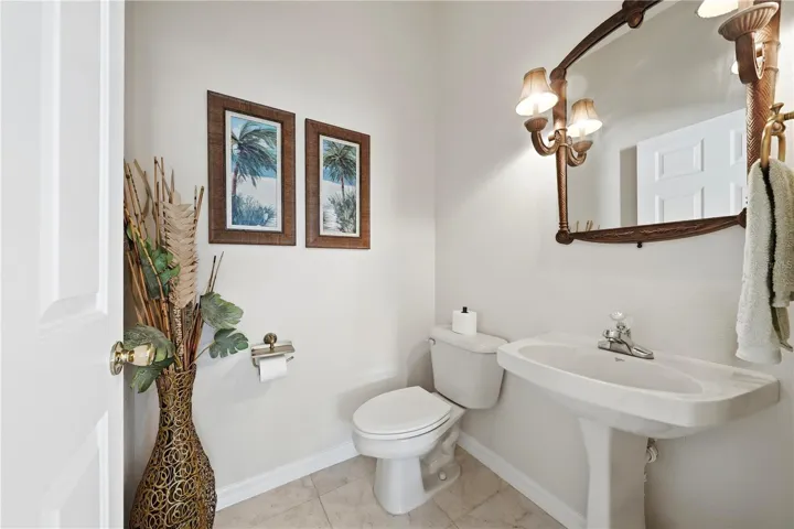 Half guest bathroom conveniently located by front door and flex room