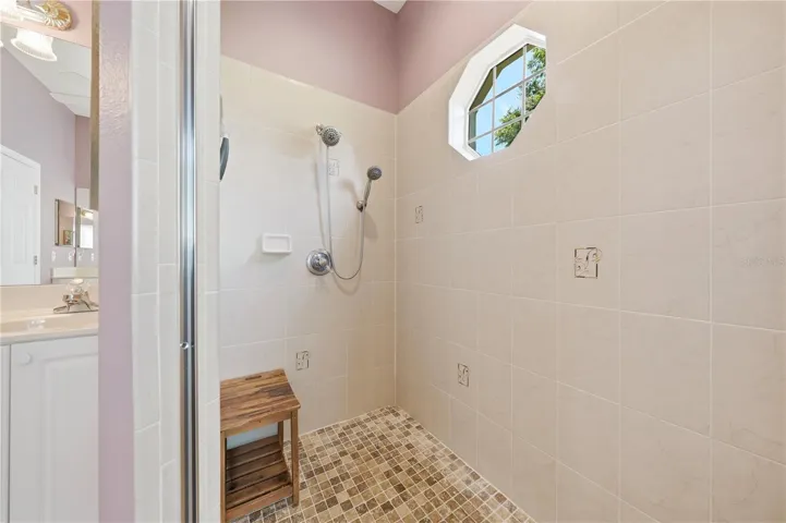 Walk in tile shower with window